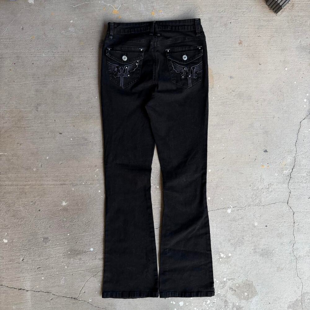 Black denim jeans with cross